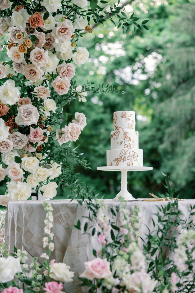 luxe flowers and cake at a wedding outside asheville, nc