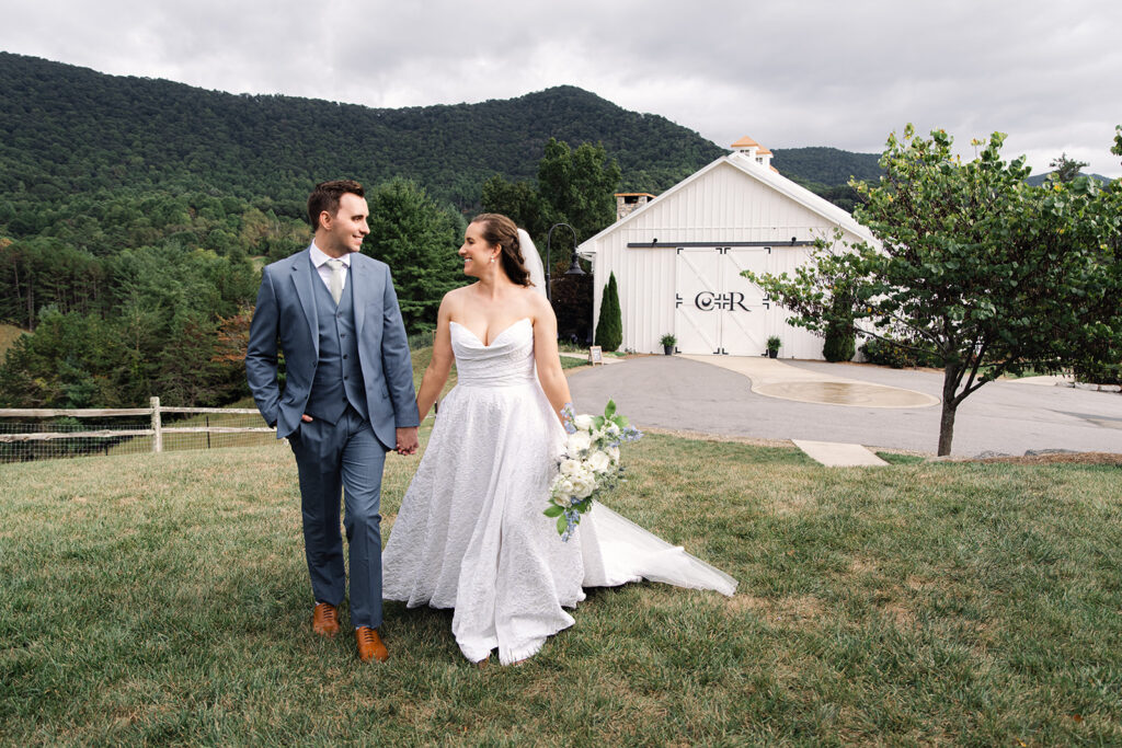 Bride and groom just married with Chestnut ridge venue behind them